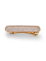 A gold and crystal barrette