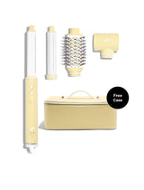 Yellow hair styling tool set with attachments on a white background