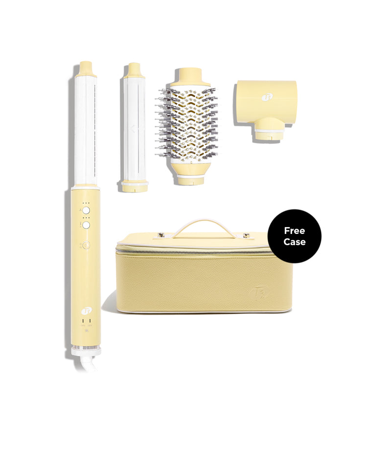 Yellow hair styling tool set with attachments on a white background