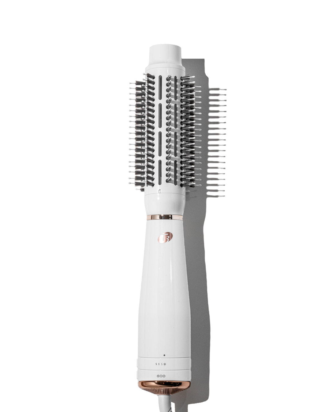 White and rose gold hair styling tool on a white background