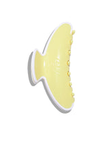 Yellow shoe with white sole on a white background